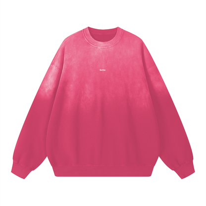 Pink sweatshirt with a brand logo on a white background