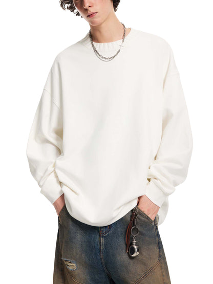 Person wearing a white sweater and jeans on a white background