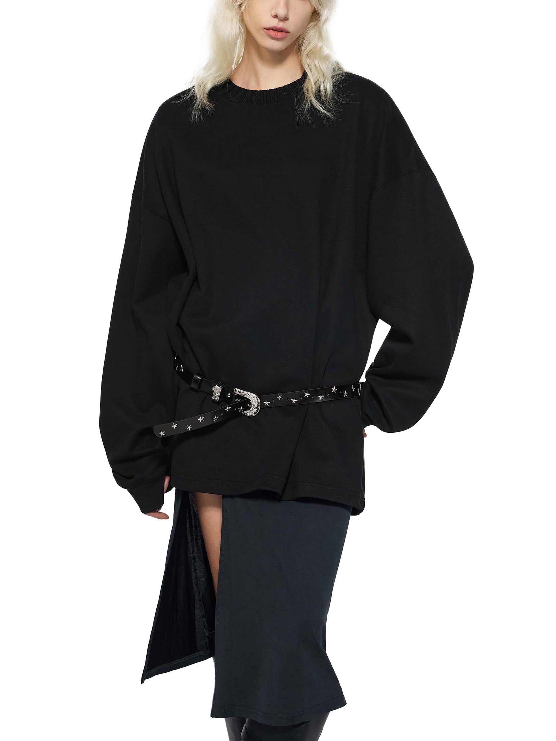 Person wearing a black outfit with a belt on a white background
